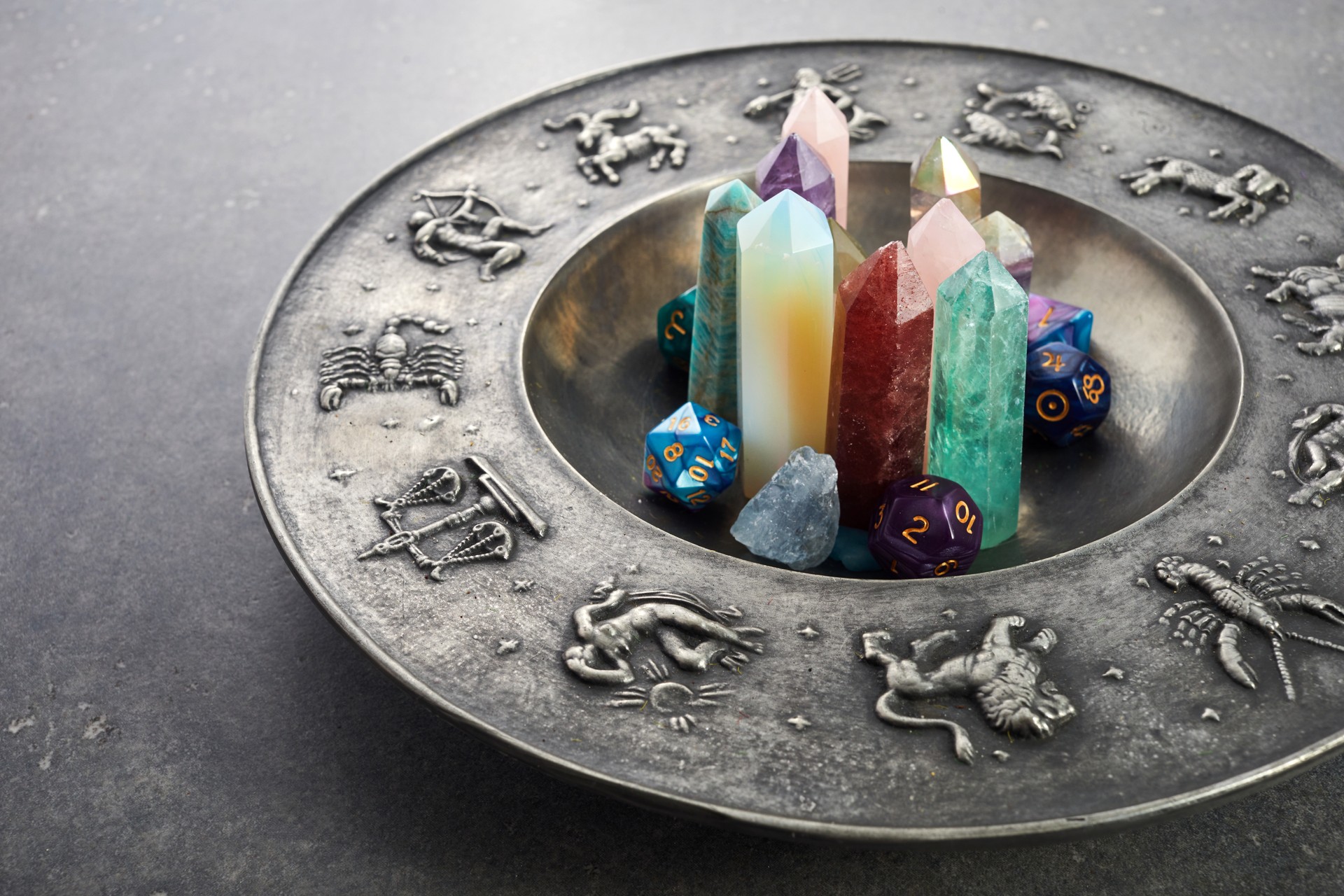 Crystals for healing, fortune telling and astrologhy circle on grey background. Esoteric and life coaching concept.